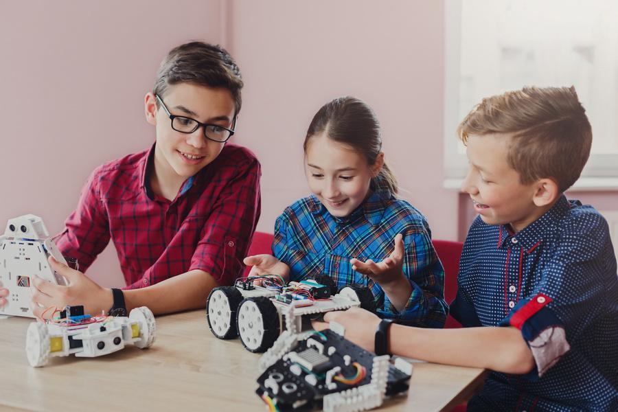 Children creating robots at school