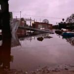 Durante temporal, moradores têm casas invadidas por enxurrada no Parque dos Sabiás